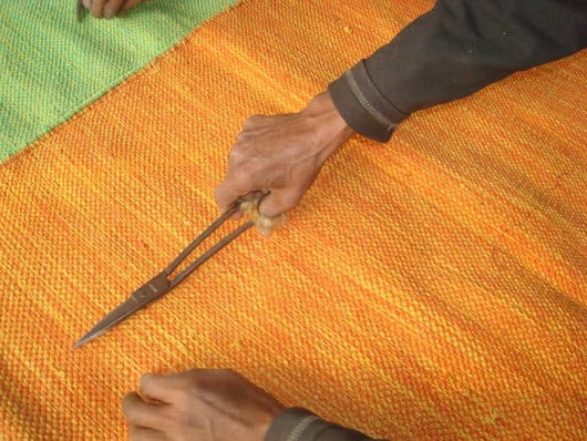 Carefully Snipped Exposed Threads by Master Weavers