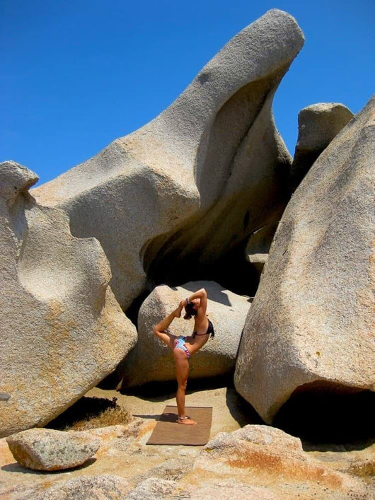 Woman Doing Yoga By the Rocks