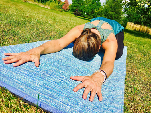 Woman Doing Yoga Exercise Using Water Yoga Mat